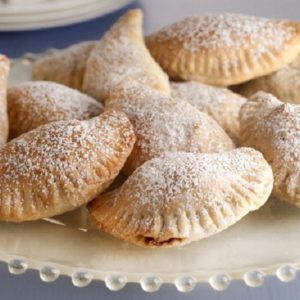 Cassatedi (kah-sah-TAY-dee) are a sweet link to Sicilian ancestors. They're wonderful treats, handheld deep-fried pockets of tender dough filled with sweetened ricotta and dusted with confectioners' sugar. (Bill Hogan/Chicago Tribune/MCT via Getty Images)